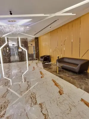 a lobby with a couch and a marble floor at Premium Lovely Studio with Balcony in Dubai in Dubai