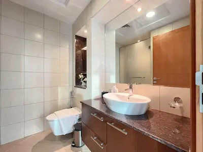 a bathroom with a sink and a toilet at Trophy Stays - Vibrant Work-Friendly Studio in Business bay in Dubai