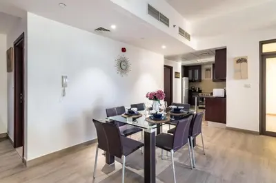a dining room with a table and chairs at The Smart Concierge - Amwaj 4 in Dubai