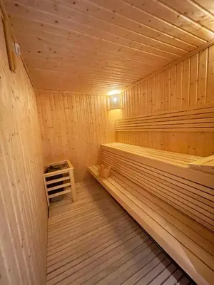 a large wooden sauna with a bench in it at STAY BY LATINEM Luxury 2BR Holiday Home CV B1614 near Burj Khalifa in Dubai