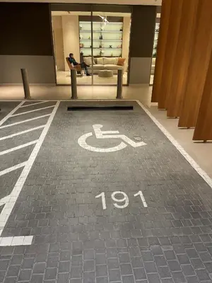 a handicapped sign on the floor of a building at STAY BY LATINEM Luxury 2BR Holiday Home CV B1614 near Burj Khalifa in Dubai