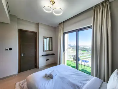 a bedroom with a large bed and a large window at STAY BY LATINEM Luxury 2BR Holiday Home CV B1614 near Burj Khalifa in Dubai