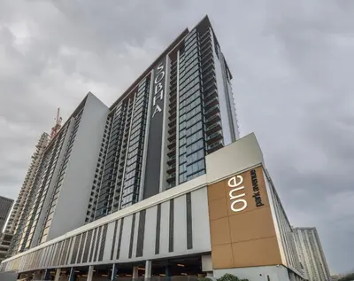 a tall building with a sign on it at STAY BY LATINEM Luxury 1 BR Holiday Home OPA 1601 near Burj Khalifa in Dubai