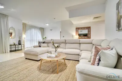 a living room with a couch and a table at Serene 1BR at Murjan 2 JBR by Deluxe Holiday Homes in Dubai