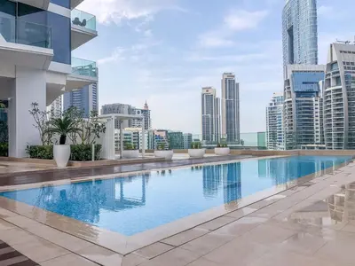 a swimming pool on the roof of a building at GuestReady - Modern Mirza with Marina View in Dubai