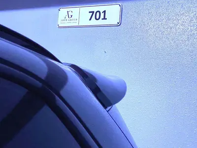 a blue car with a speed limit sign on it at Boutique Luxury Living near Palm Jumeirah in Dubai