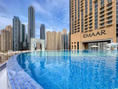 a large swimming pool in the middle of a city at Welcome Home at The Address Marina 1BR in Dubai