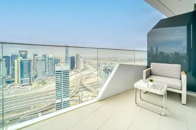 a balcony with a chair and a view of a city at Stella Maris, Dubai Marina - Mint Stay in Dubai
