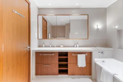 a bathroom with a sink and a mirror at Holidays R Us Royal View in Dubai