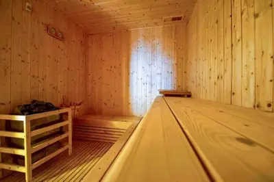 an empty wooden sauna with a wooden floor at Ocean Heights - Spacious 1 Bedroom Apartment with Sea View, Gym & Free Parking in Dubai
