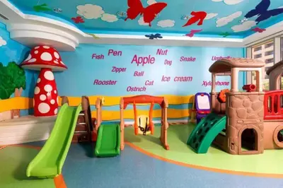 a childrens play room with different types of play equipment at Ocean Heights - Spacious 1 Bedroom Apartment with Sea View, Gym & Free Parking in Dubai