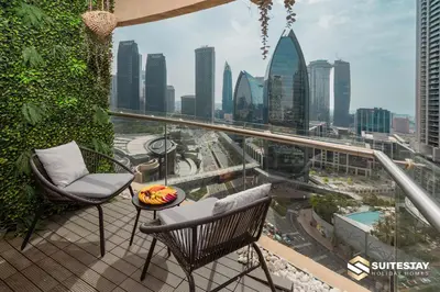 a balcony with a view of a city skyline at OSTAY -Address Dubai Mall - The Residence in Dubai