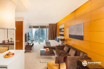 a living room with a couch and a bed at OSTAY -Address Dubai Mall - The Residence in Dubai