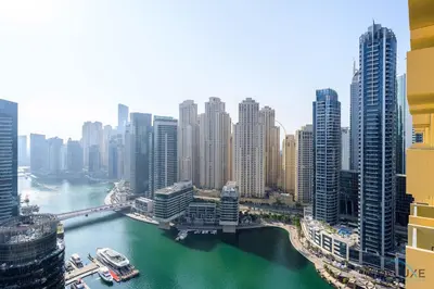a view of a city with a river and buildings at Ornate 1BR in The Address Residences Dubai Marina by Deluxe Holiday Homes in Dubai