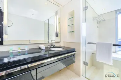 a bathroom with a sink and a mirror at Ornate 1BR in The Address Residences Dubai Marina by Deluxe Holiday Homes in Dubai