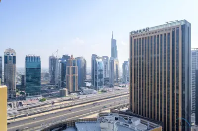 a view of a city with a highway and buildings at Ornate 1BR in The Address Residences Dubai Marina by Deluxe Holiday Homes in Dubai