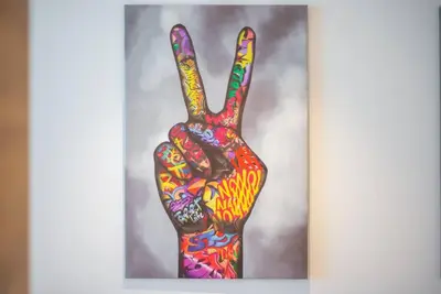 a painting of a hand painted in colorful paint at Funky STUDIO Dubai Marina outstanding facilities in Dubai