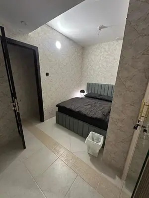 a bedroom with a bed and a bathroom with a shower at Fabulous Palm View in Dubai
