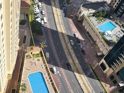 an aerial view of a city street with buildings at USMANS 5 BEDROOM APARTMENT at JBR WALK RIMAL ON THE BEACH 2750 SFT HUGE Direct Beach Access Fully Serviced JBR in Dubai
