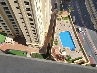 an overhead view of a pool in the middle of a building at USMANS 5 BEDROOM APARTMENT at JBR WALK RIMAL ON THE BEACH 2750 SFT HUGE Direct Beach Access Fully Serviced JBR in Dubai