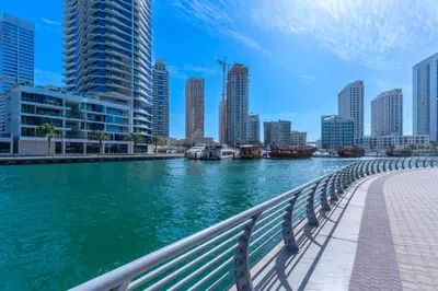 a view of a river in a city with tall buildings at Modern 1BR in Dubai Marina Near Metro & Beach in Dubai