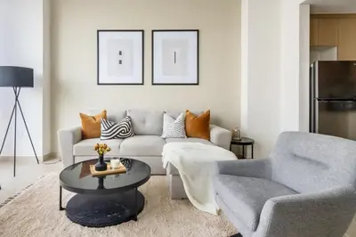 a living room with a couch and a table at GuestReady - Contemporary with Ain Dubai View in Dubai