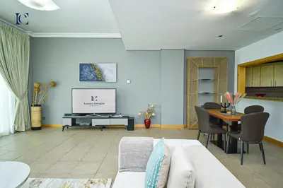 a living room with a couch and a table at Luxury Escapes - Palm Jumeirah's Spectacular Ocean-View Apartment - NABAT in Dubai