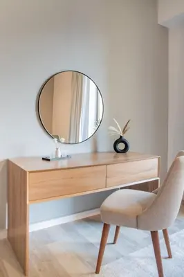 a dressing table with a mirror and a chair at GuestReady - Sea la Vie - Lux in JBR in Dubai