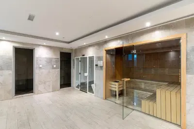 a room with a shower and a glass wall at Spacious Studio I Close to Dubai Canal in Dubai