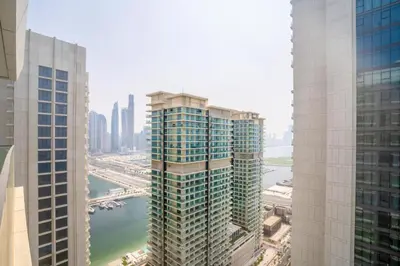 an aerial view of two tall buildings next to a river at HomesGetaway-Luxury 2Br Apartment in Beach Vista Tower 2 in Dubai