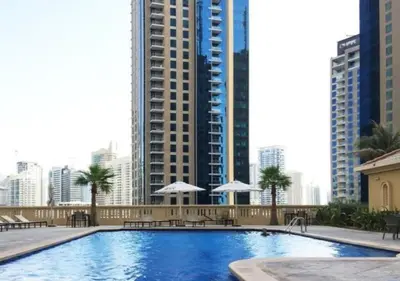 a large swimming pool in a city with tall buildings at 360 Vacation - Spacious 3BR Close to the Beach I Rimal1 JBR in Dubai