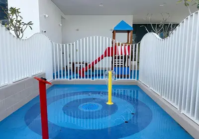 a small pool in a room with a playground at Stunning 1BR in Stella Maris, City View, Marina in Dubai