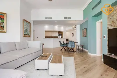a living room with a couch and a table at Keysplease Upgraded 3 B/R + Nanny Beach Access, Palm Jumeirah in Dubai