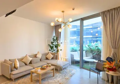 a living room with a couch and a table at Unique 1BR in Stella Maris,City View,Dubai Marina in Dubai