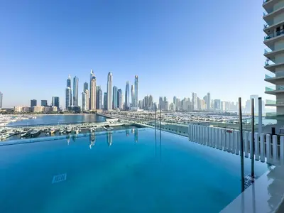 a view of a city skyline from a swimming pool at Glamorous 3BR with Marina view in Dubai