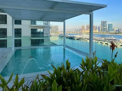 a large swimming pool on top of a building at Glamorous 3BR with Marina view in Dubai
