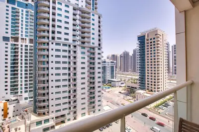 a view of a city from a balcony at Beautiful Studio on 10 floor of Marina View Tower in Dubai