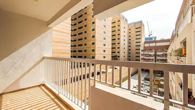 a balcony with a view of some buildings at Cozy Apartment In Laya Residence JVC in Dubai