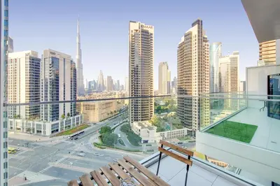 a balcony with a view of a city with tall buildings at Vacationer l Bright Studio l Burj Khalifa View l Business Bay in Dubai