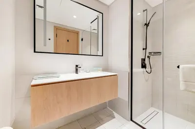 a bathroom with a sink and a shower at Vacationer l Bright Studio l Burj Khalifa View l Business Bay in Dubai