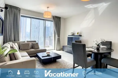 a living room with a couch and a table at Standpoint A, Downtown - Contemporary One Bedroom in Dubai