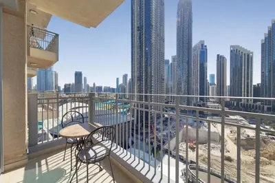 a balcony with a bench and a view of a city at Standpoint A, Downtown - Contemporary One Bedroom in Dubai