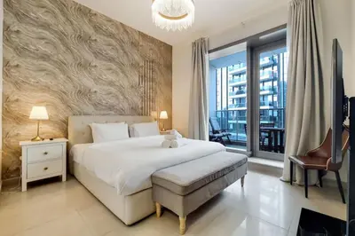 a bedroom with a large bed and a large window at Vacationer I Sparkle T1 2 Bedroom I Marina Views I Steps away from Beach I Gym, Pool, Parking & Wi-Fi in Dubai
