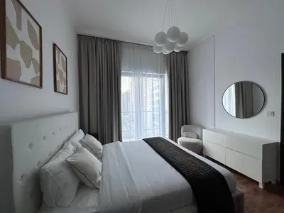 a white bedroom with a bed and a window at Bay Central- Marina Dubai, One bed room Apartment in Dubai
