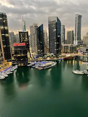 a view of a city with boats in the water at Bay Central- Marina Dubai, One bed room Apartment in Dubai
