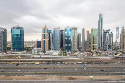 a view of a city with a highway and buildings at Frank Porter - West Avenue in Dubai