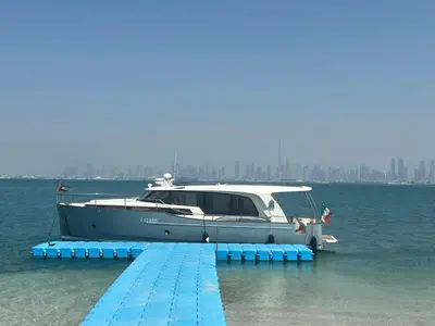 a boat is docked at a dock in the water at Yacht Experience - Stella Romana in Dubai