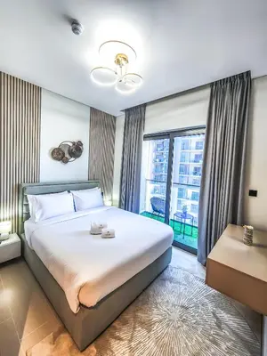 a bedroom with a large bed and a large window at STAY BY LATINEM Luxury 2BR Holiday Home CV B2302 near Burj Khalifa in Dubai