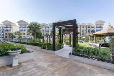 a courtyard with a gazebo in front of a building at Superb Amenities - 1BR in Resortz by Danube,Arjan - Allsopp&Allsopp in Dubai