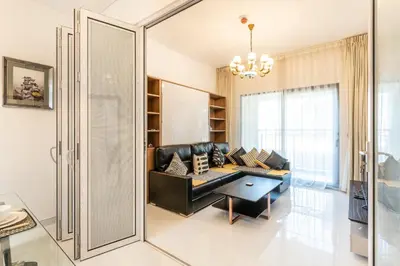 a living room with a couch and a table at Superb Amenities - 1BR in Resortz by Danube,Arjan - Allsopp&Allsopp in Dubai